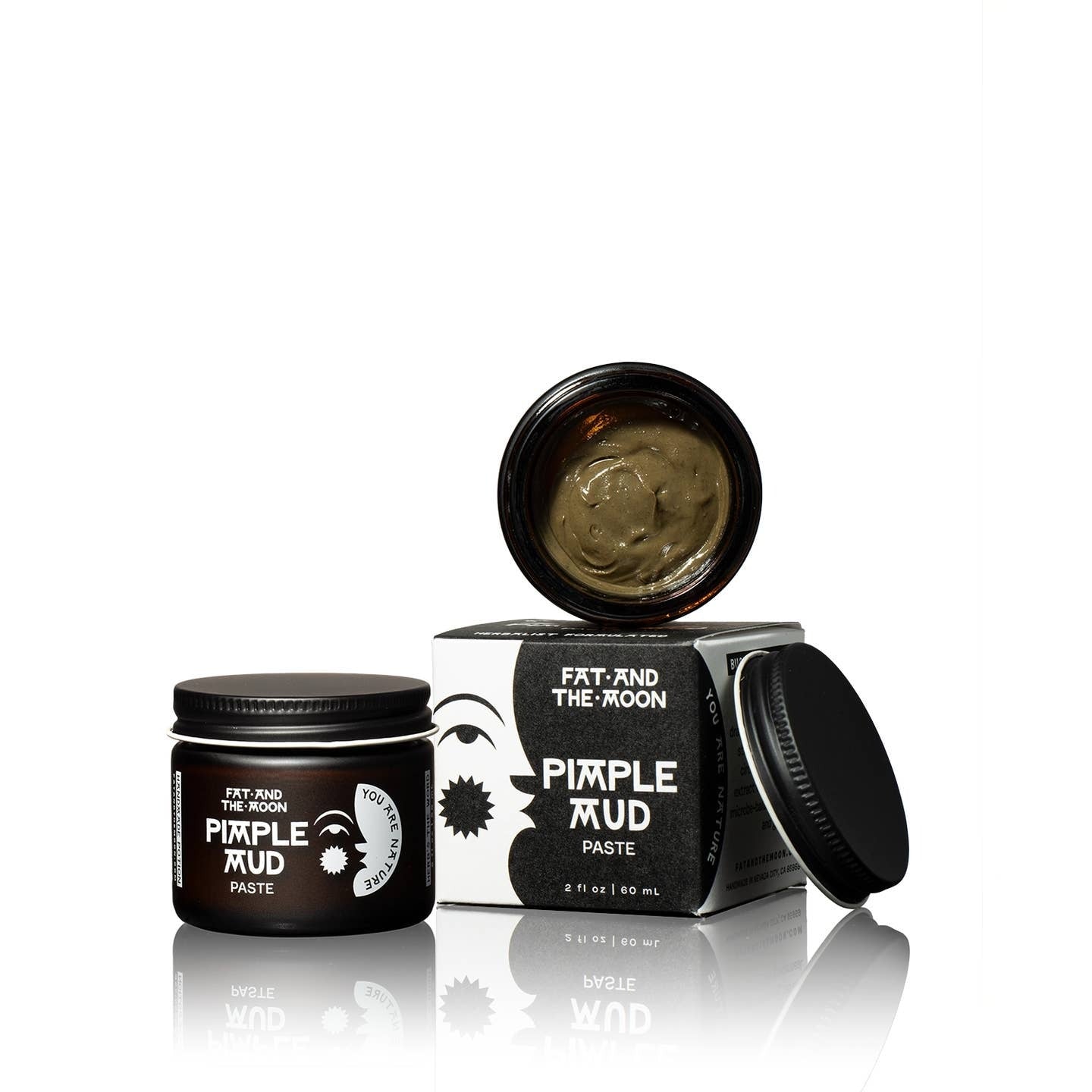 Two jars of 'Pimple Mud' paste by 'Fat and the Moon' on a white background