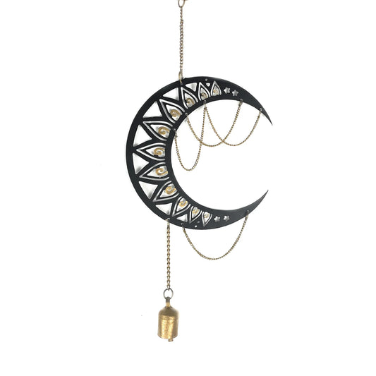 A hand-cut moon chime with a smooth black surface and delicate gold chain details, hanging from a chain with a bell at the bottom.