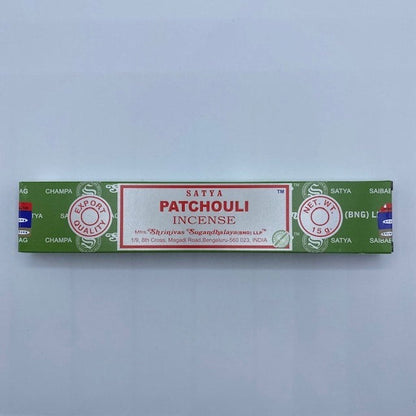 white, green and red incense box on grey background