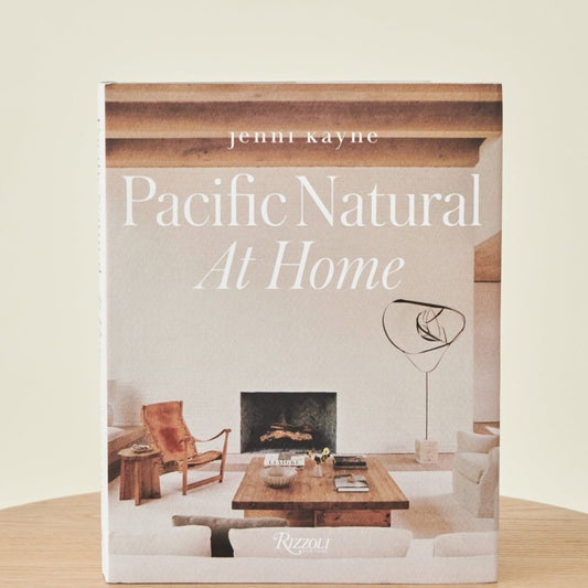A coffee table book titled 'Pacific Natural At Home' by Jenni Kayne, featuring photographs of interior design.