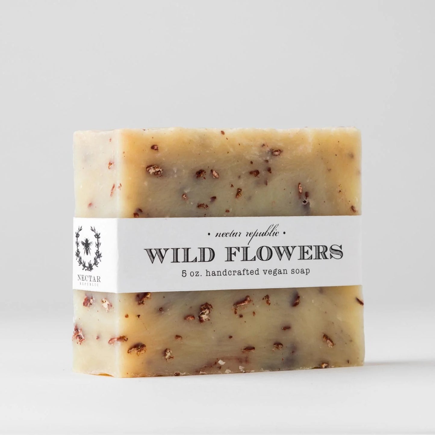 Bar of soap with a 'Wild Flowers' label on a light gray background