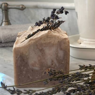 Bar of soap with lavender on a marble surface