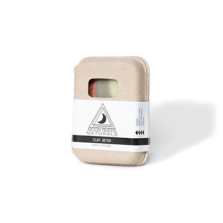 Beige soap bar box with a white label on a white background