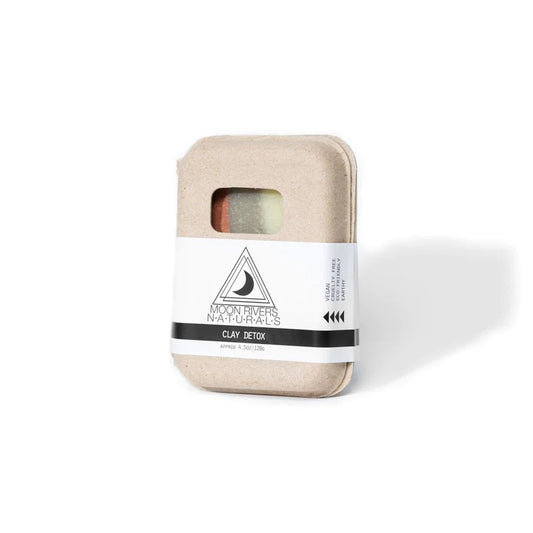 Beige soap bar box with a white label on a white background