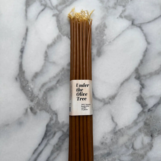 Beeswax candles on marble background