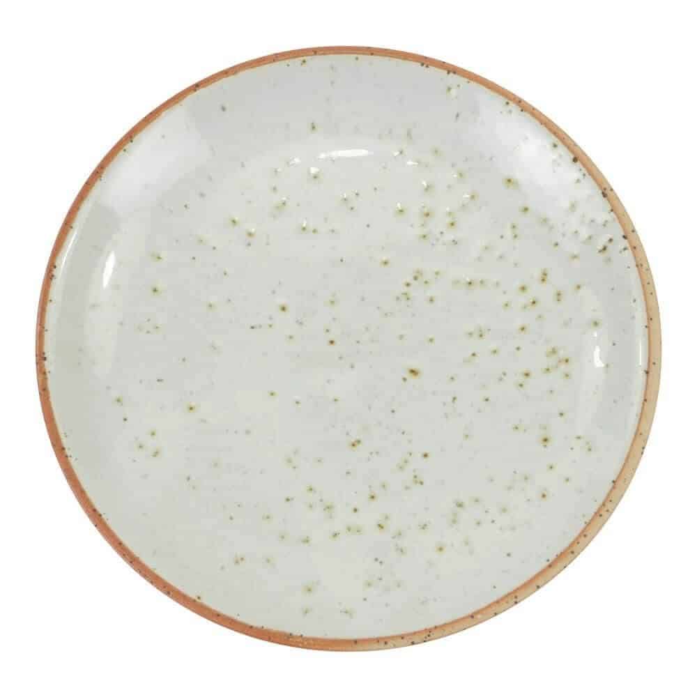 Round ceramic plate with a speckled design on a white background