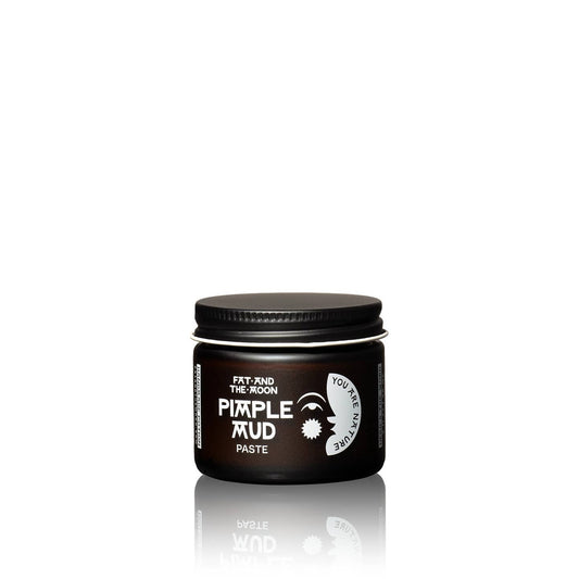 Jar of pimple mud paste on a white background
