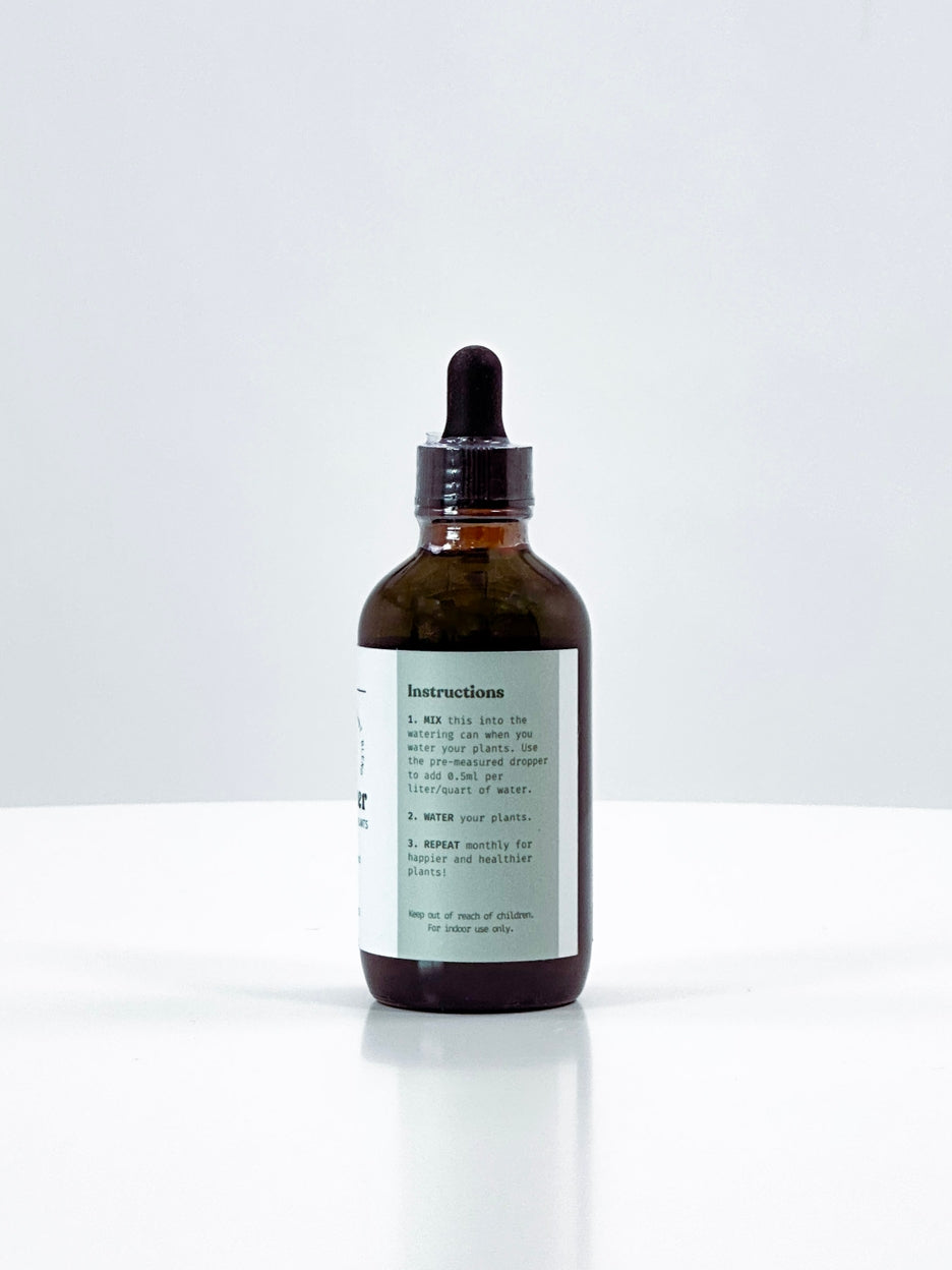 Brown glass bottle with dropper on a white background