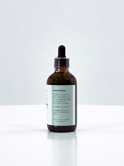 Brown glass bottle with dropper on a white background