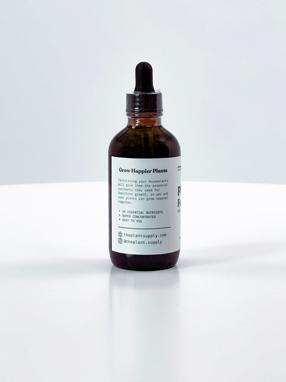 Brown glass bottle with dropper on a white background