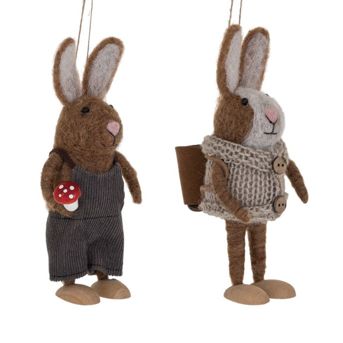Set of two rabbit ornaments hanging on a white background