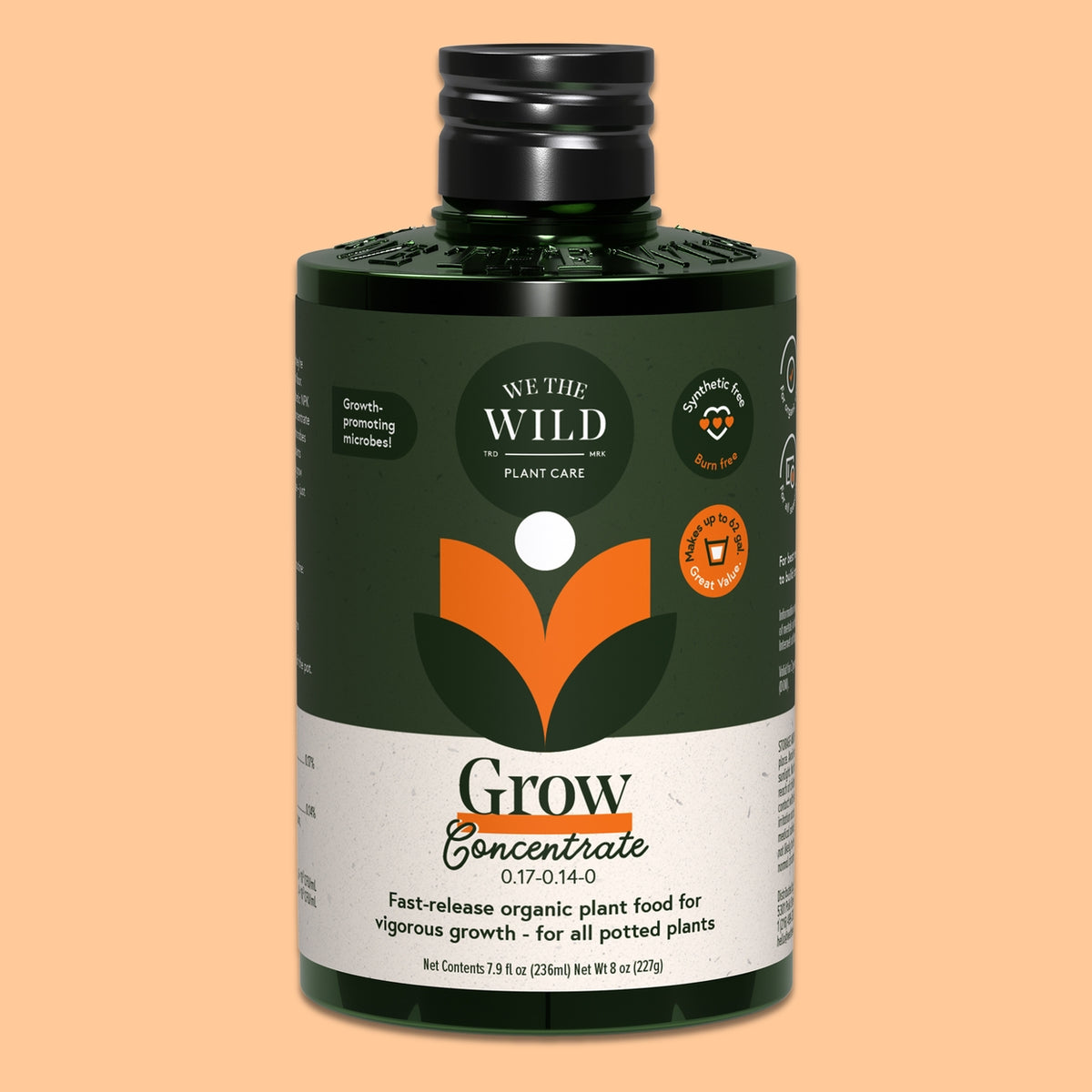 A bottle of We the Wild Grow Concentrate plant food, featuring a dark green label with orange and white graphics, a black cap, and a white lower section, set against a solid peach background.