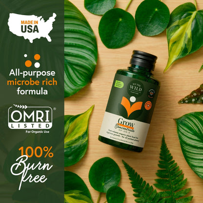 Bottle of Grow Concentrate with green leaves on a wooden surface, featuring OMRI Listed and 100% Burn Free labels.