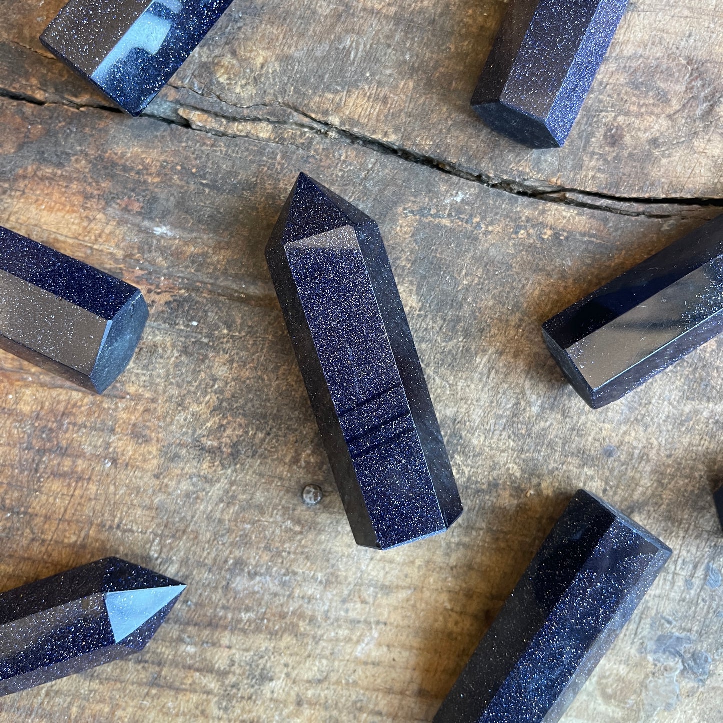 Blue stone blocks on a wooden surface