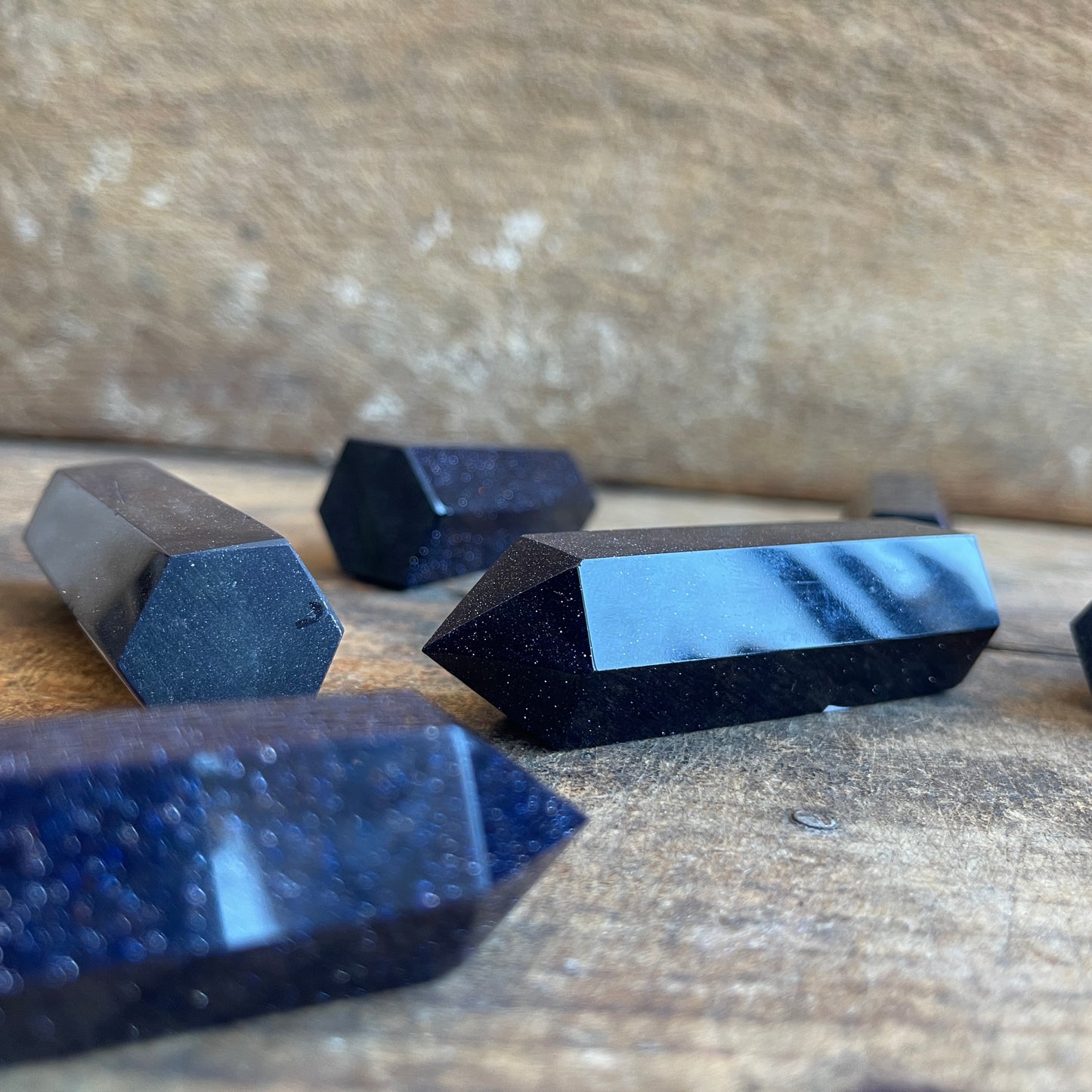 Blue goldstone on a wooden surface