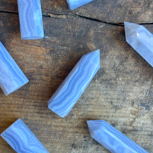 Blue lace agate crystals on a wooden surface
