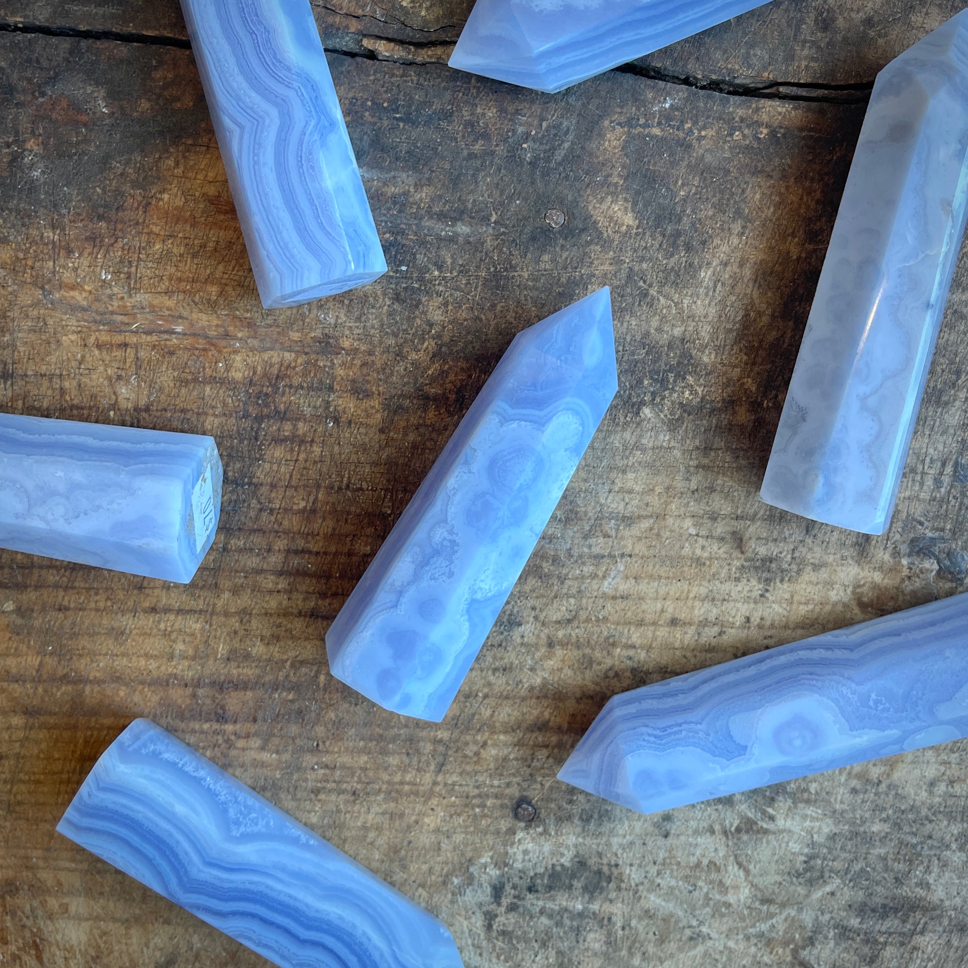 Blue agate stones on a wooden surface