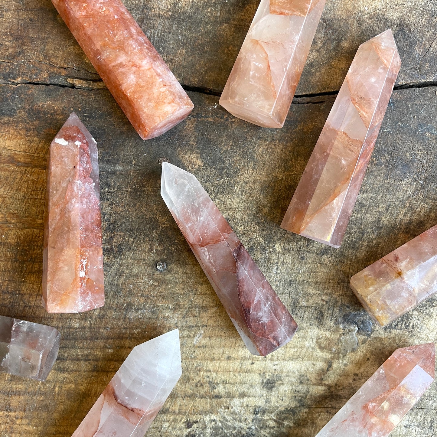 Fire quartz points on a wooden surface