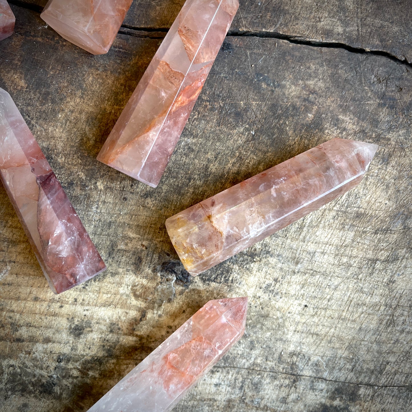 Fire quartz points on a wooden surface