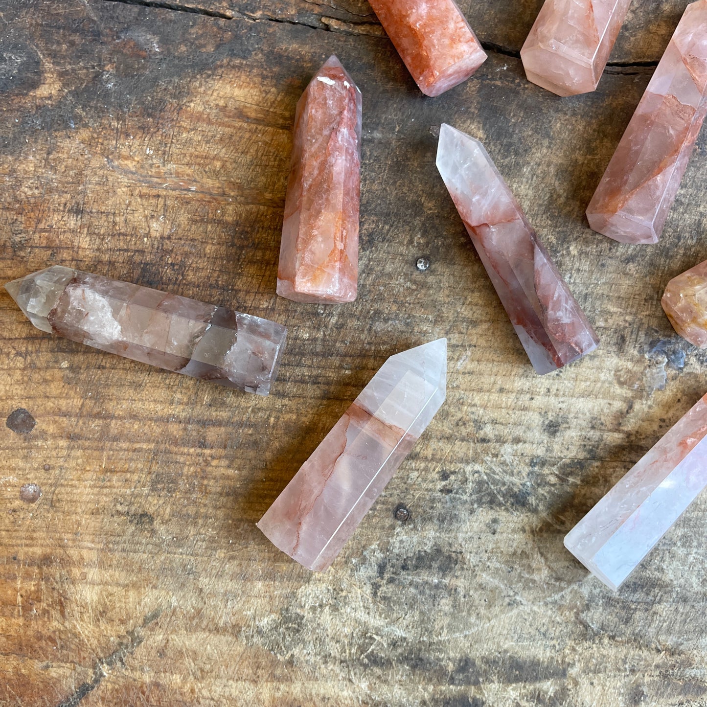 Fire quartz points on a wooden surface