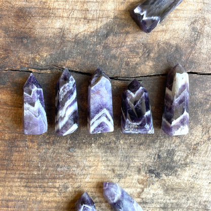 Amethyst crystal points on a wooden surface