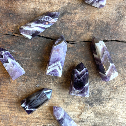 Amethyst crystals on a wooden surface