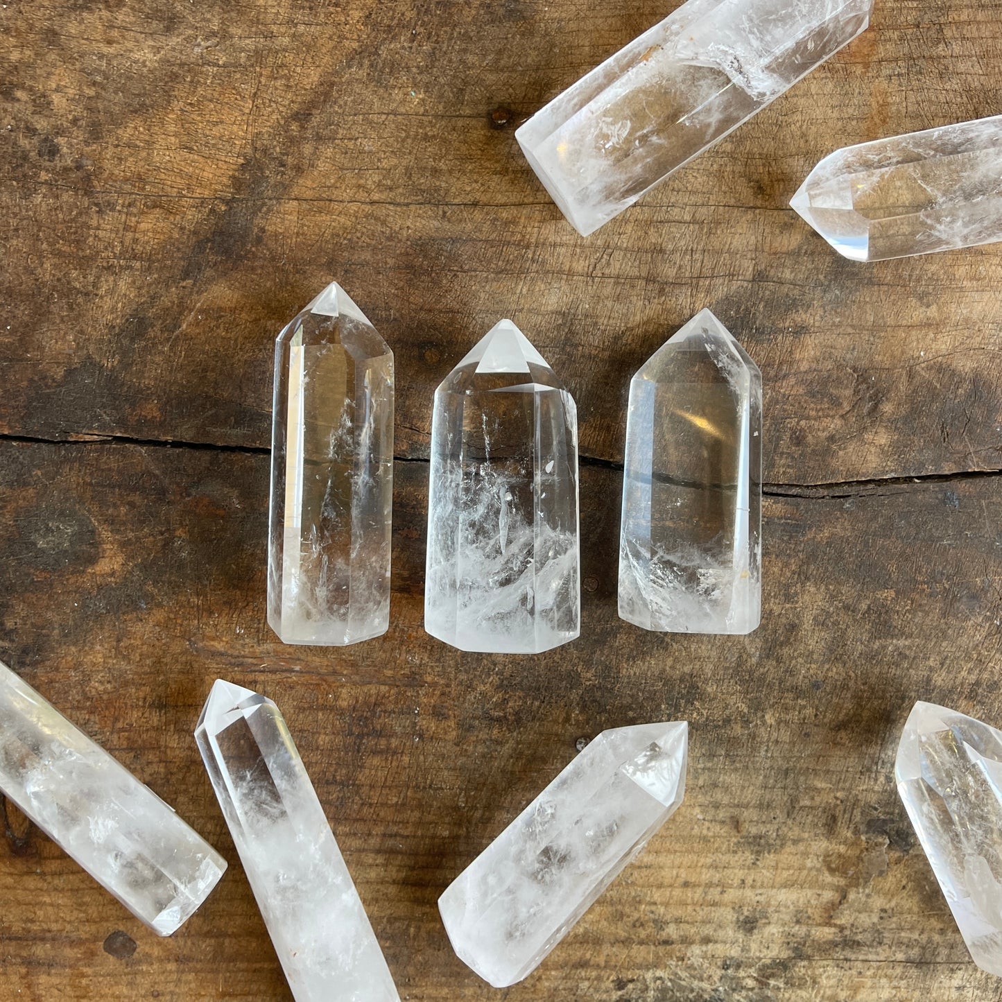 Clear crystal points on a wooden surface