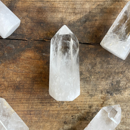 Clear crystal points on a wooden surface
