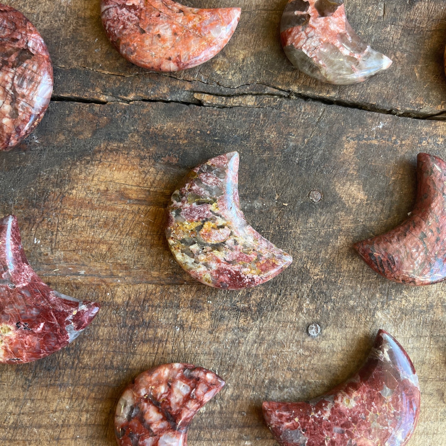 Jasper moons on a wooden surface