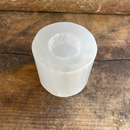 Clear crystal object on a wooden surface