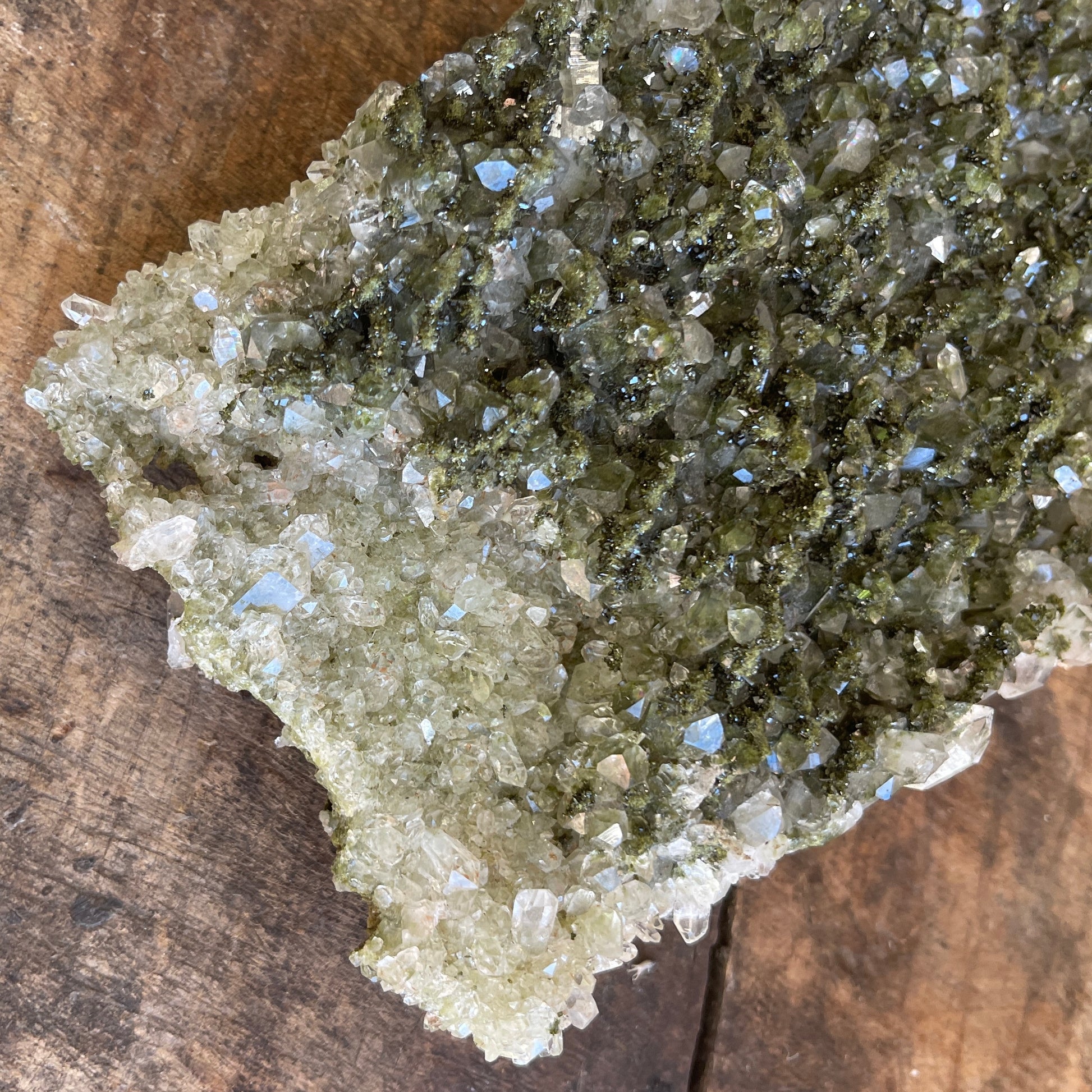 Close-up of a crystal formation on a wooden surface