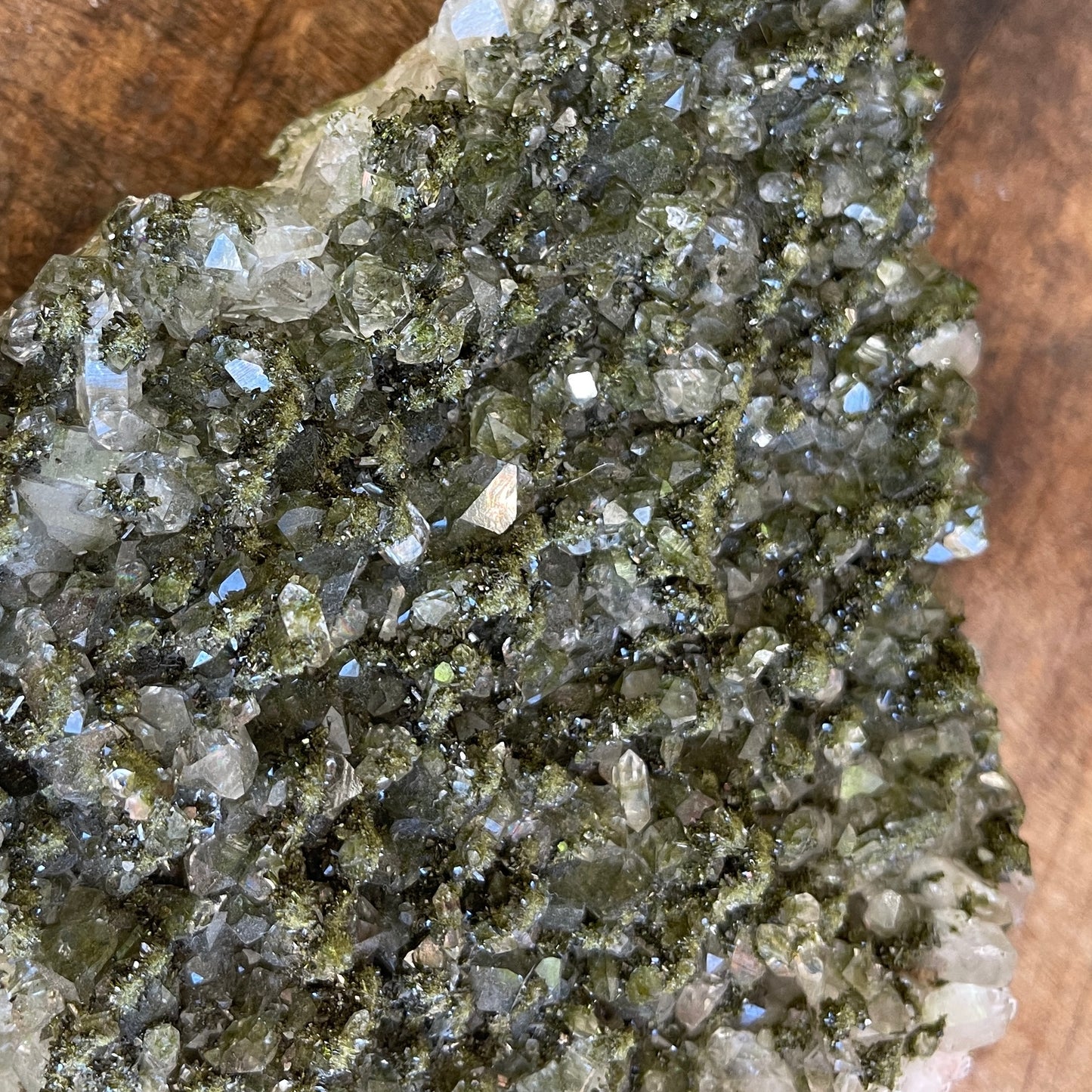 Close-up of a cluster of crystals on a wooden surface