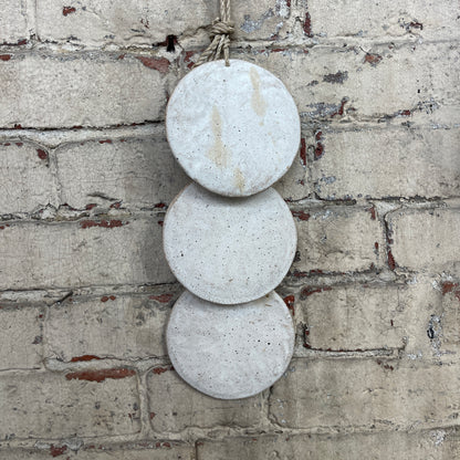 Wall hanger made from 3 ceramic discs, strung from rope