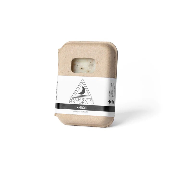 Facial bar in a beige container with a white label on a white background