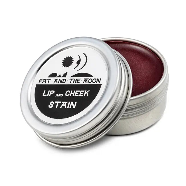 Lip and cheek stain in a metal tin with 'Fat and the Moon' branding on a white background