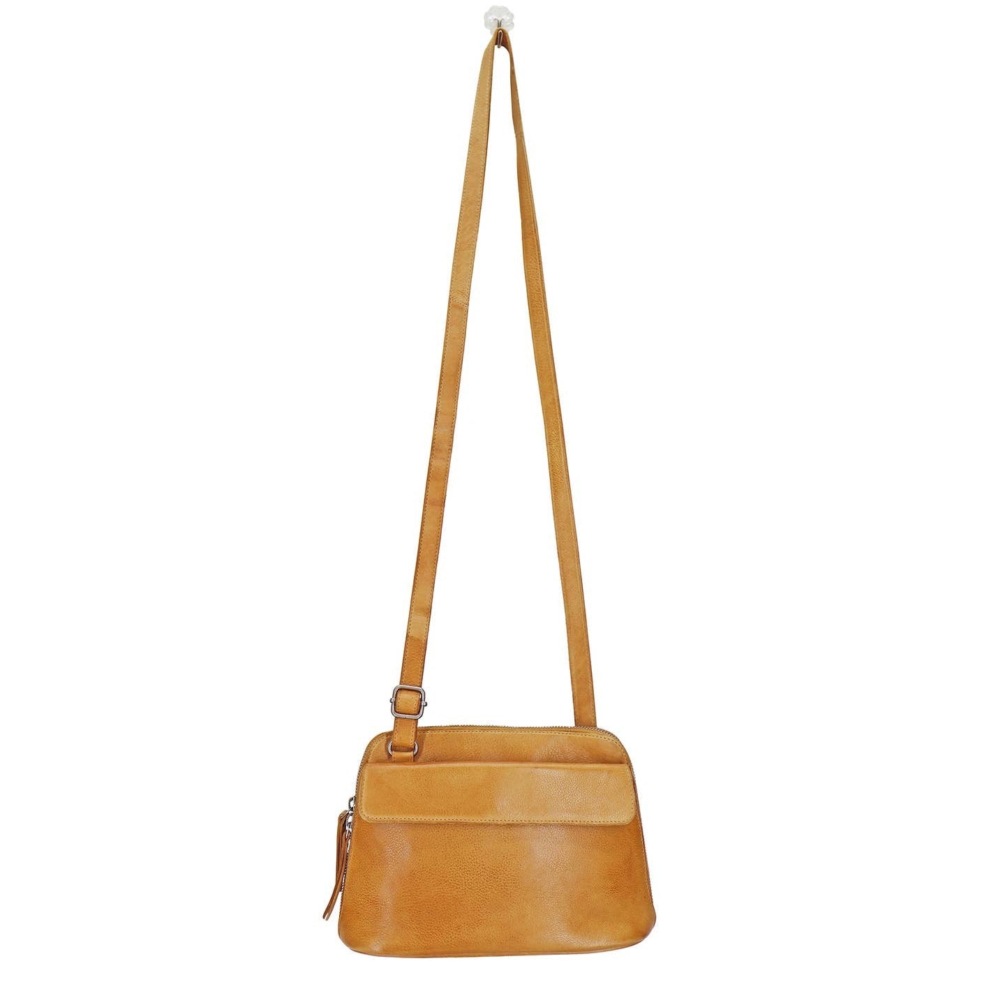 Tan leather crossbody bag with a strap on a white background