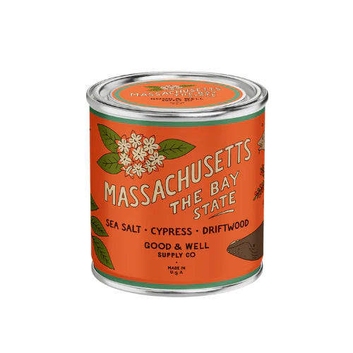 Massachusetts themed candle with orange label on white background