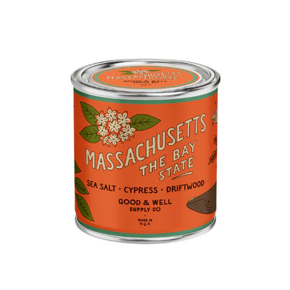 Massachusetts themed candle with orange label on white background