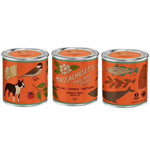 Massachusetts themed candle with orange label on white background