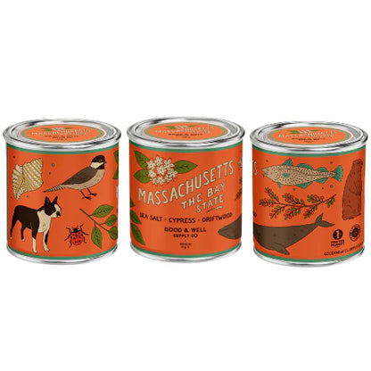 Massachusetts themed candle with orange label on white background