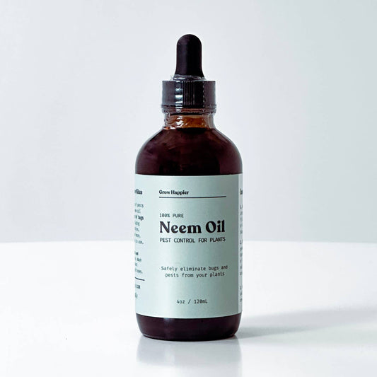 A 4oz amber glass dropper bottle of Neem Oil by Green Hooper, featuring a black rubber dropper cap and a white label with black text, set against a clean white background.