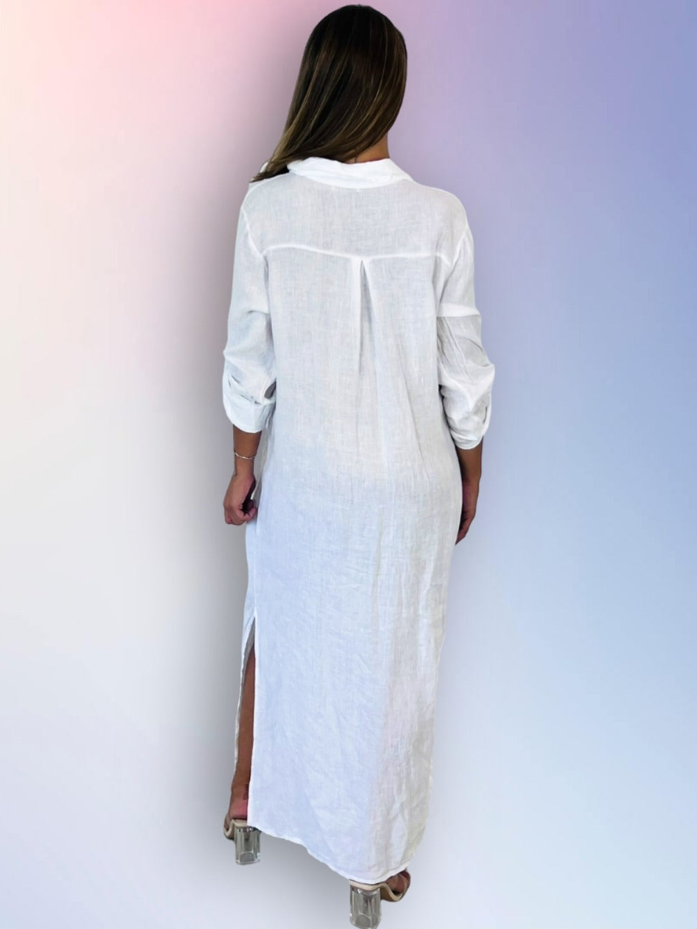 Woman wearing a white long dress with a blurred gradient background