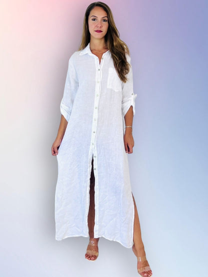 Woman wearing a long white shirt dress against a gradient background