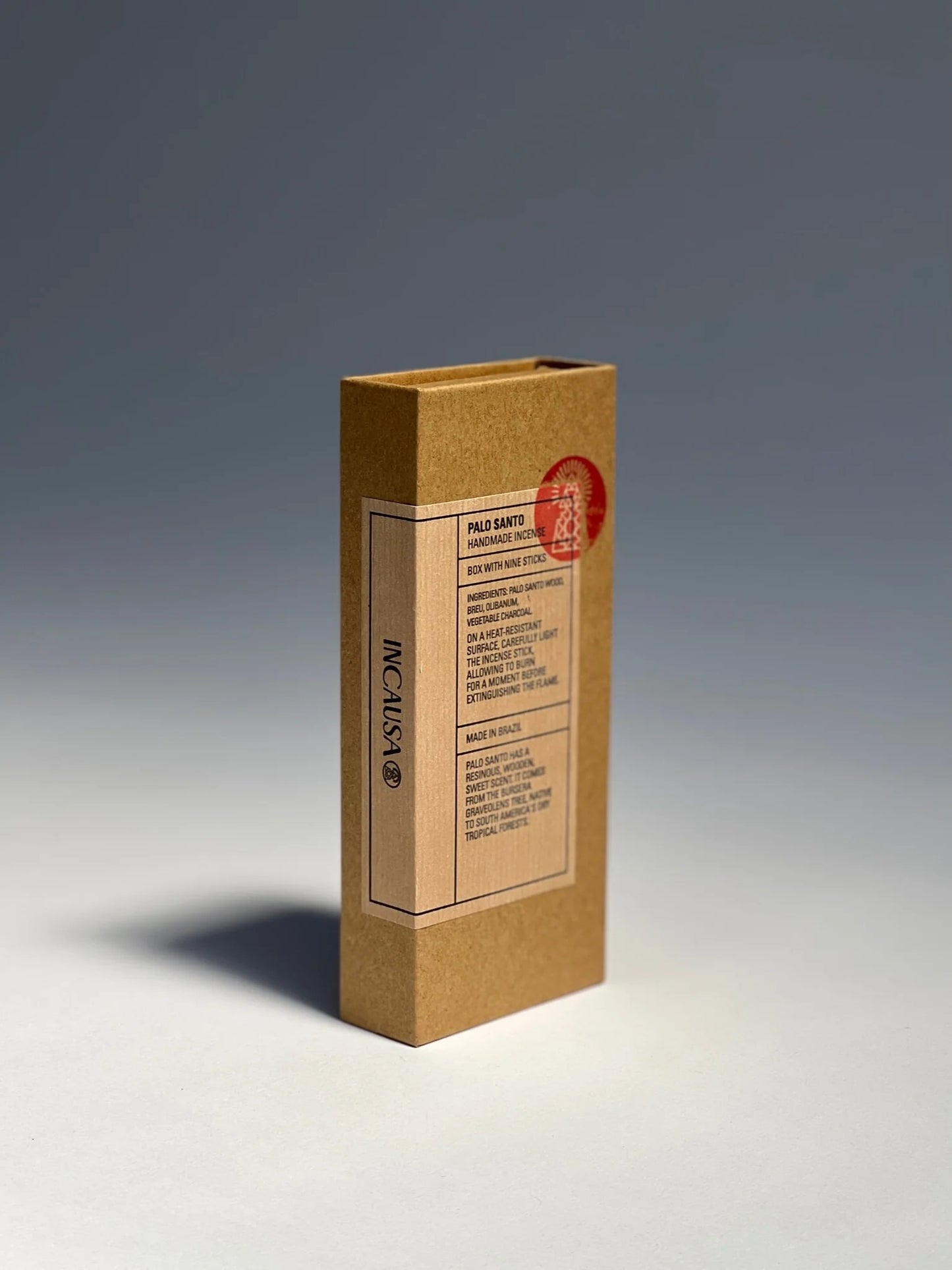 Palo Santo Incense - Rectangular cardboard box with a brown label and text on a gradient background