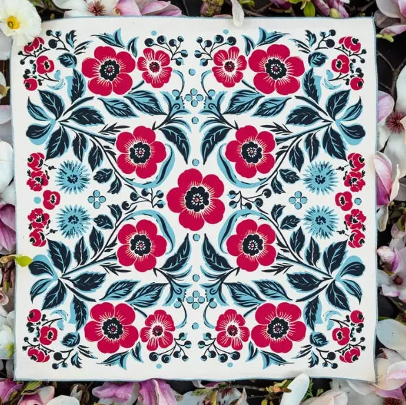 Floral pattern with red and blue flowers on a white background
