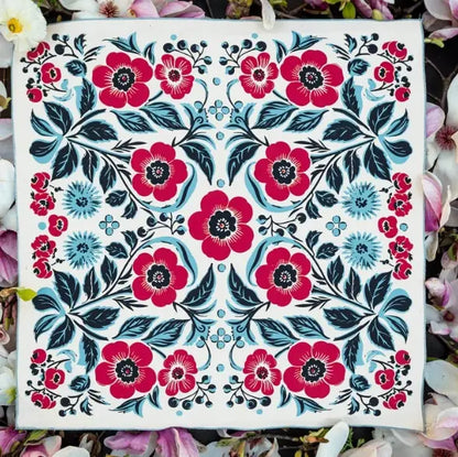 Floral pattern with red and blue flowers on a white background