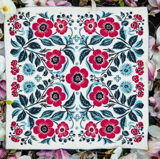 Floral pattern with red and blue flowers on a white background