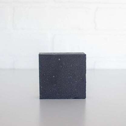 Black square block on a white background