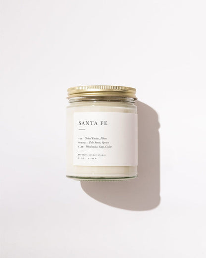 Candle jar labeled 'Santa Fe' on a white background