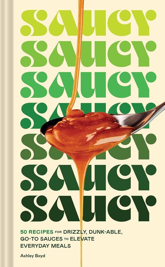 Book cover of 'Saucy' with green text and a spoonful of sauce.